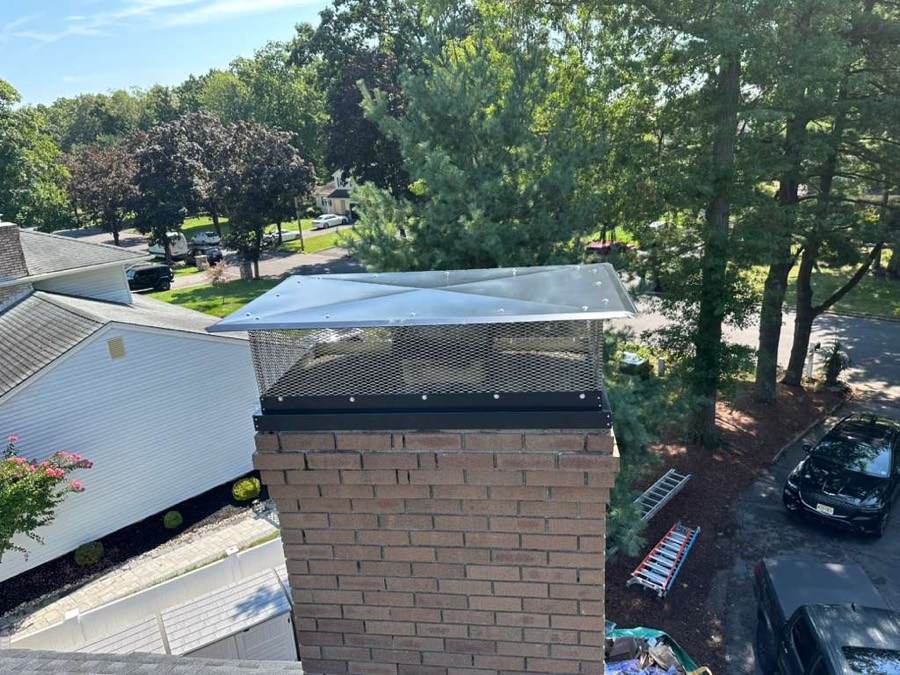 Brick chimney with custom stainless chase cover