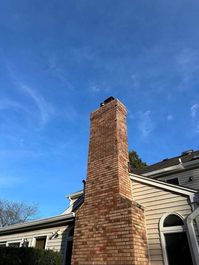 Tall brick chimney repointing project