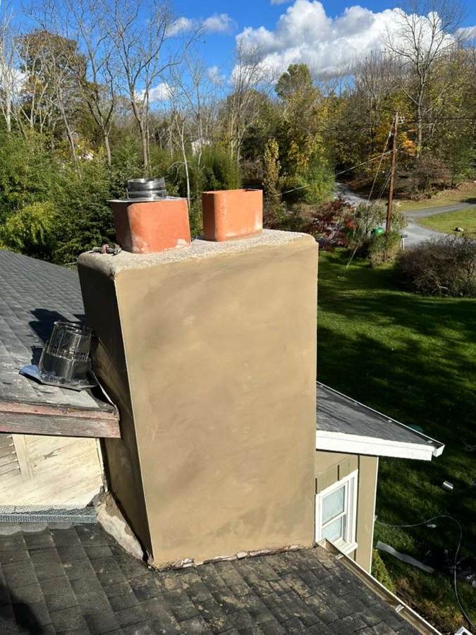 Stucco chimney with new clay flue tiles