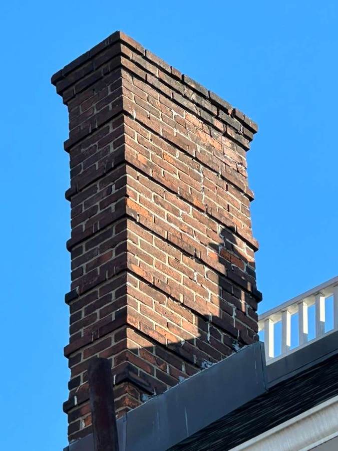Repointed brick chimney repair